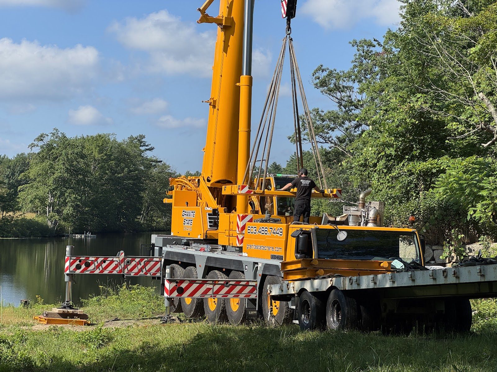 The crane set up over the dam, counterweights on.