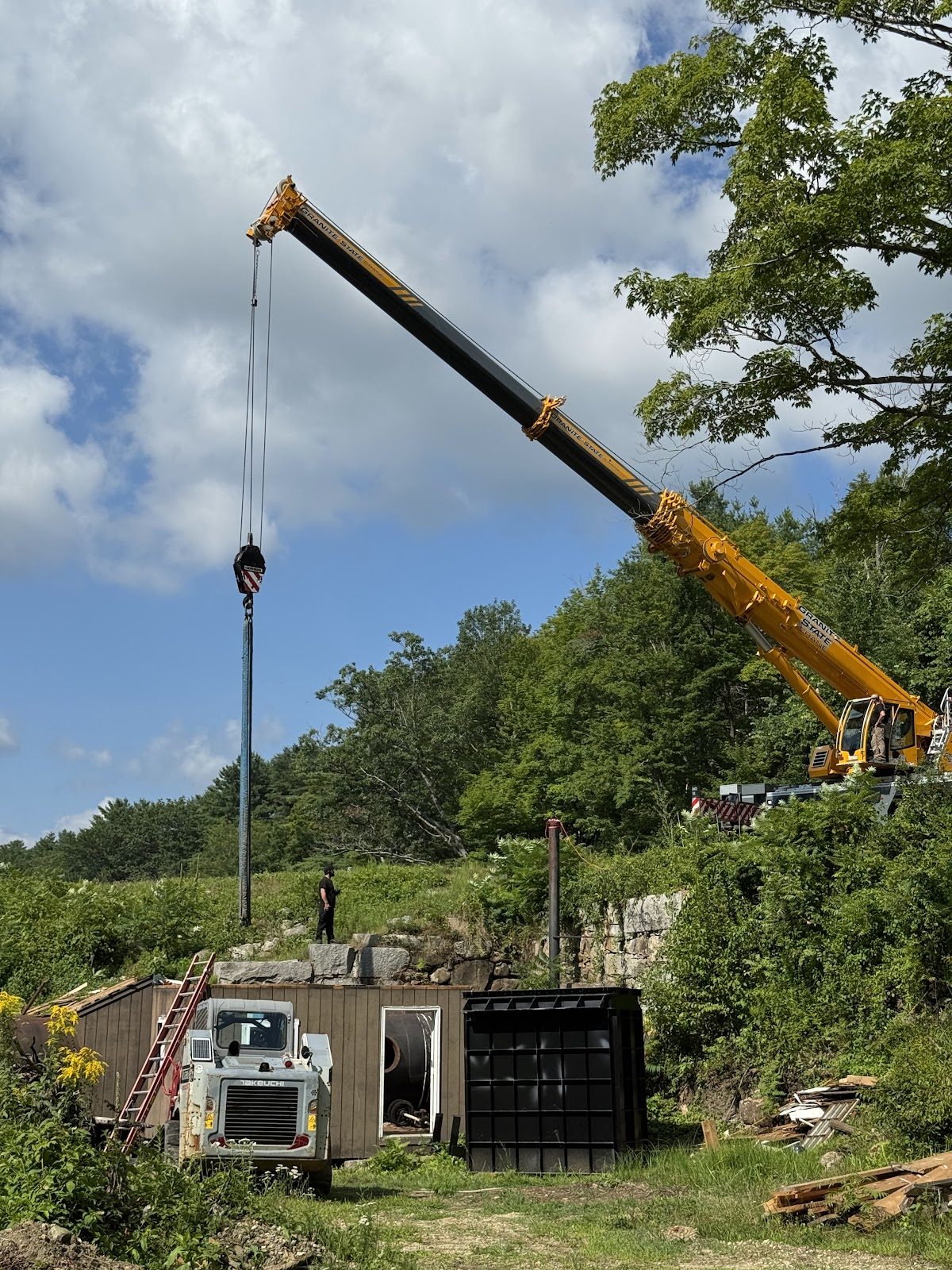 The crane reaching in over the old powerhouse.