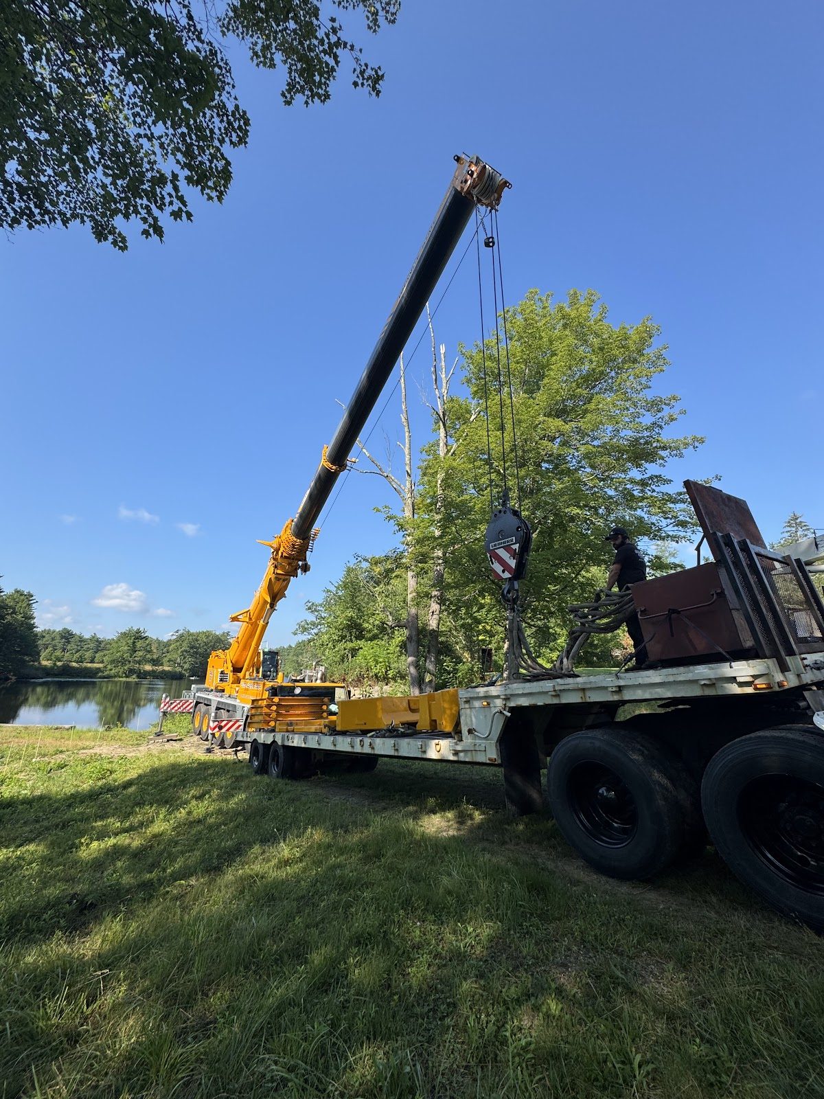 Boom sections staged for assembly.