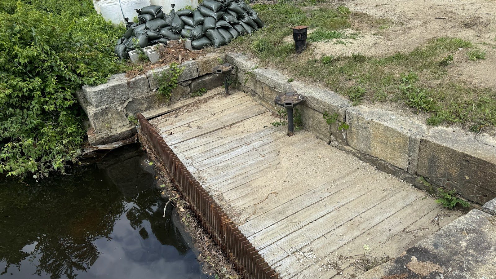 Old timber cribwork, underwater for generations, seeing daylight.