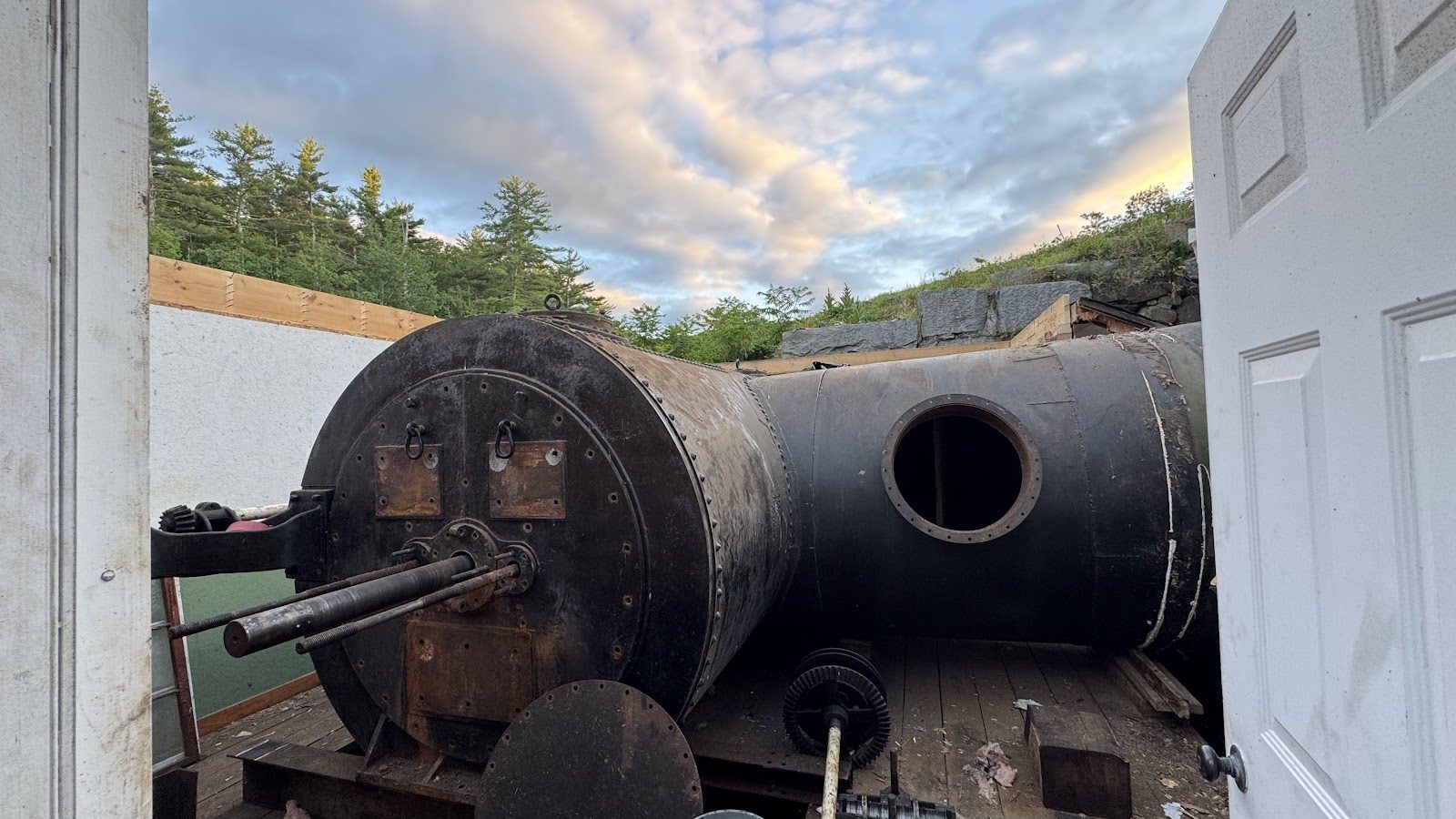 Old equipment in the roofless powerhouse, awaiting the crane.