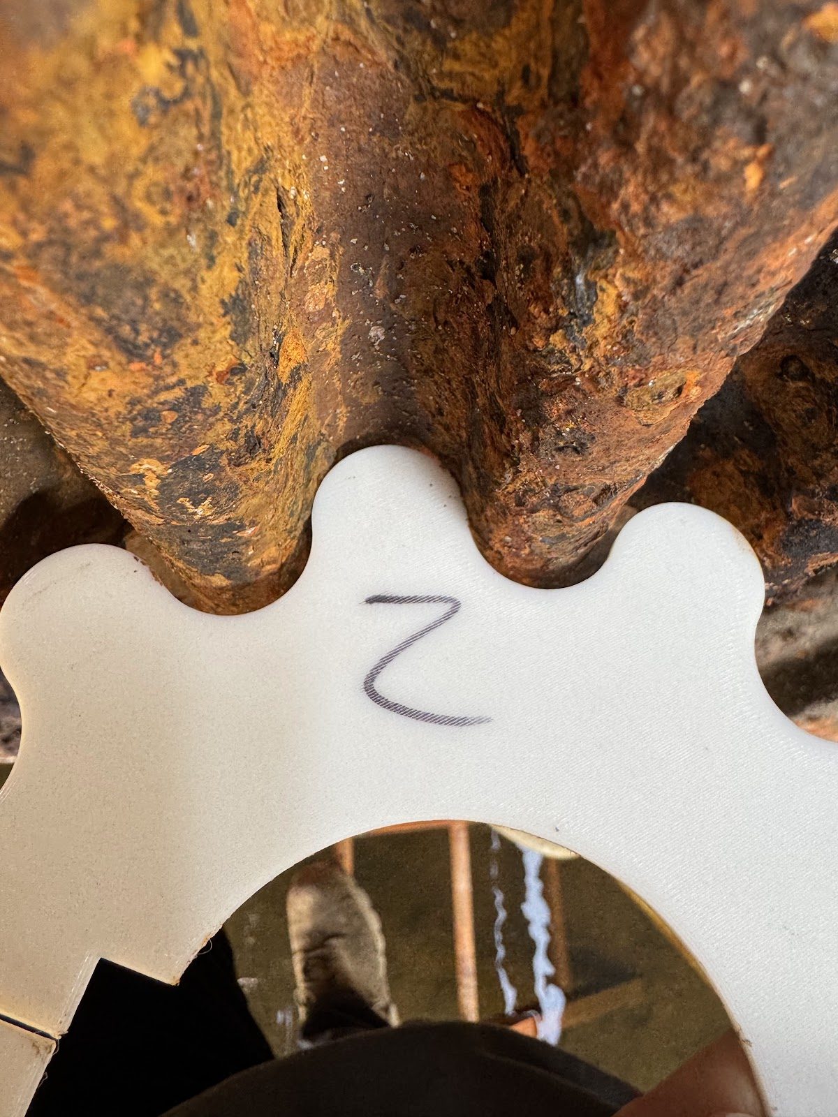 A century-and-a-half-old pinion alongside its replacement template.
