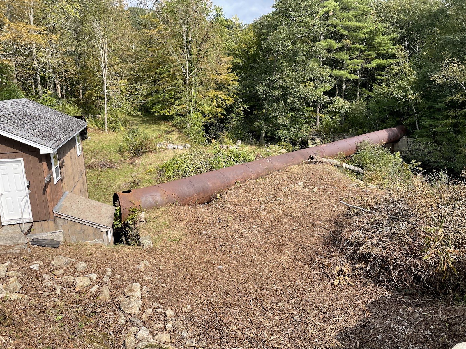 The penstock arriving at the powerhouse.