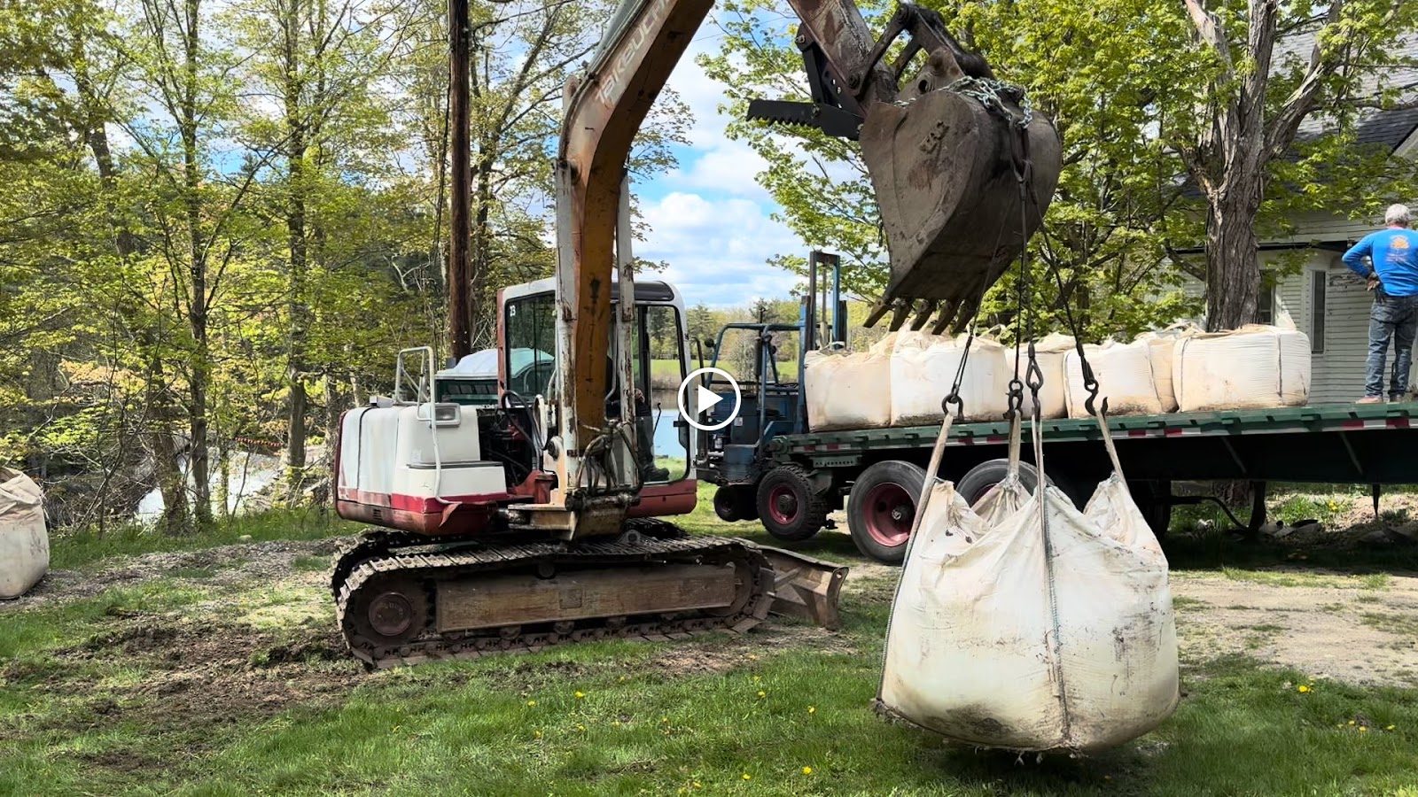 Moving material by the one-ton bag.