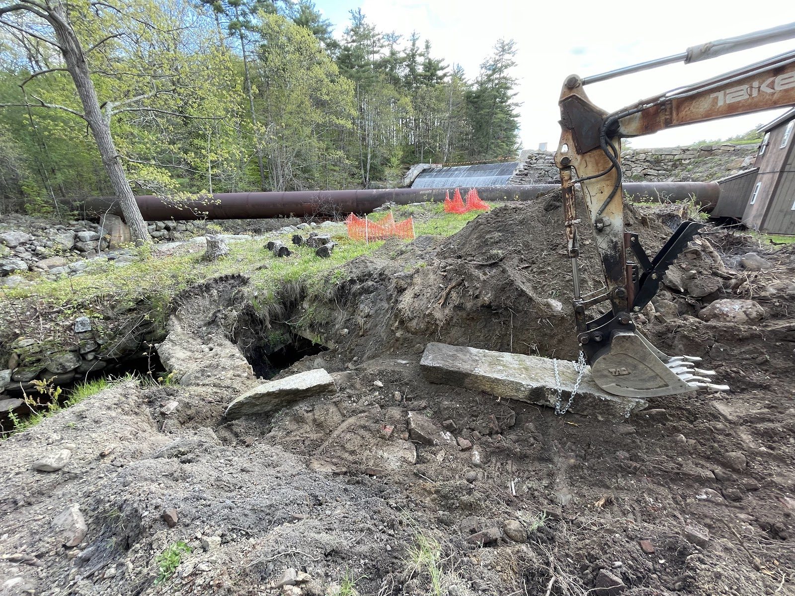 Trench work beside the old structures.